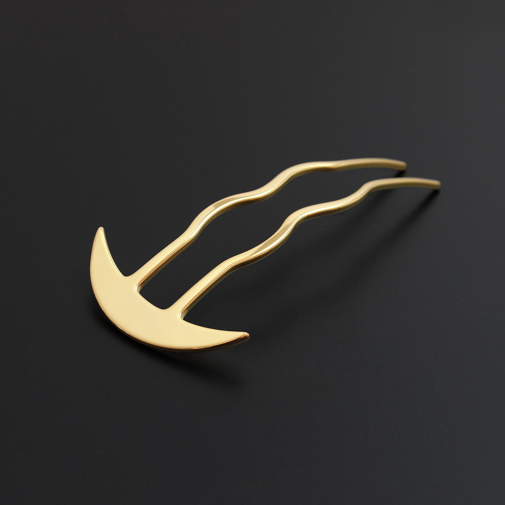 Gold hairpin on a black background
