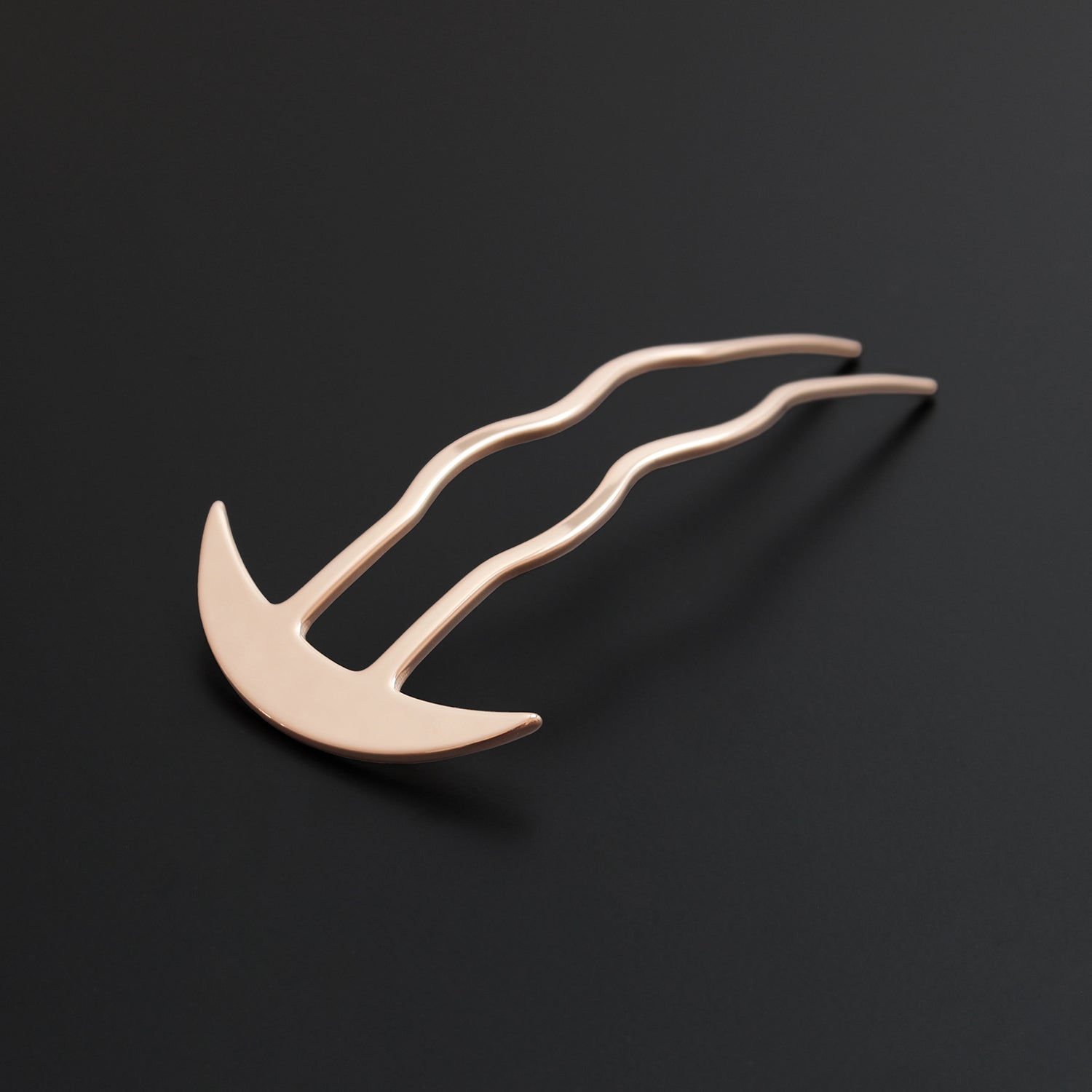 Gold hairpin on a black background