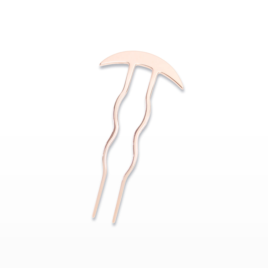 Rose gold hairpin on a white background