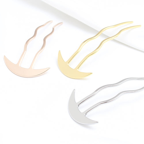 Three metallic hair clips in gold, silver, and rose gold on a white background